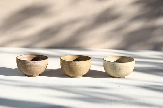 A set of 3 brown beige bowls