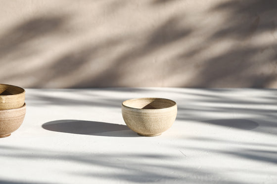 A set of 3 brown beige bowls