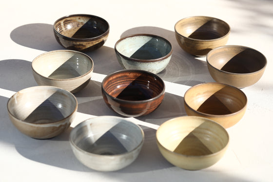 A set of 3 brown shinny bowls