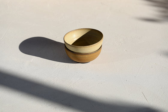 A set of 2 brown bowls