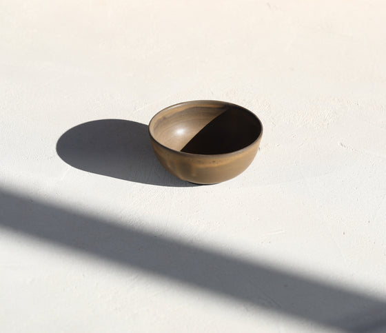 A set of 2 brown bowls