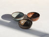 A set of 3 brown shinny bowls