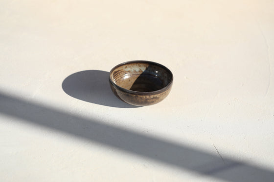 A set of 3 brown shinny bowls