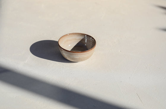 A set of 3 brown shinny bowls