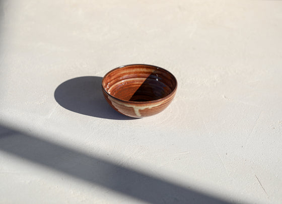 A set of 3 brown shinny bowls