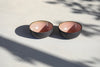 A set of 2 black pink bowls