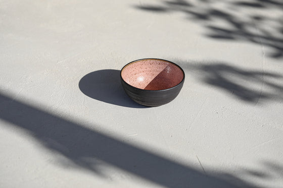 A set of 2 black pink bowls