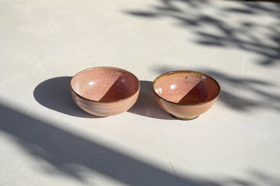 A set of 2 pink bowls