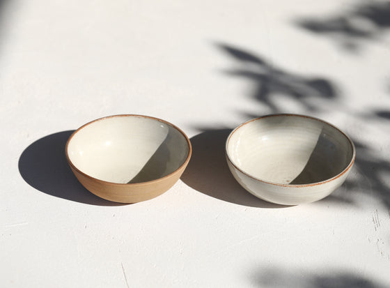 A set of 2 brown bowls