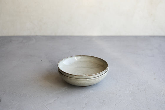 A set of 2 shallow gray bowls