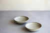 A set of 2 shallow gray bowls